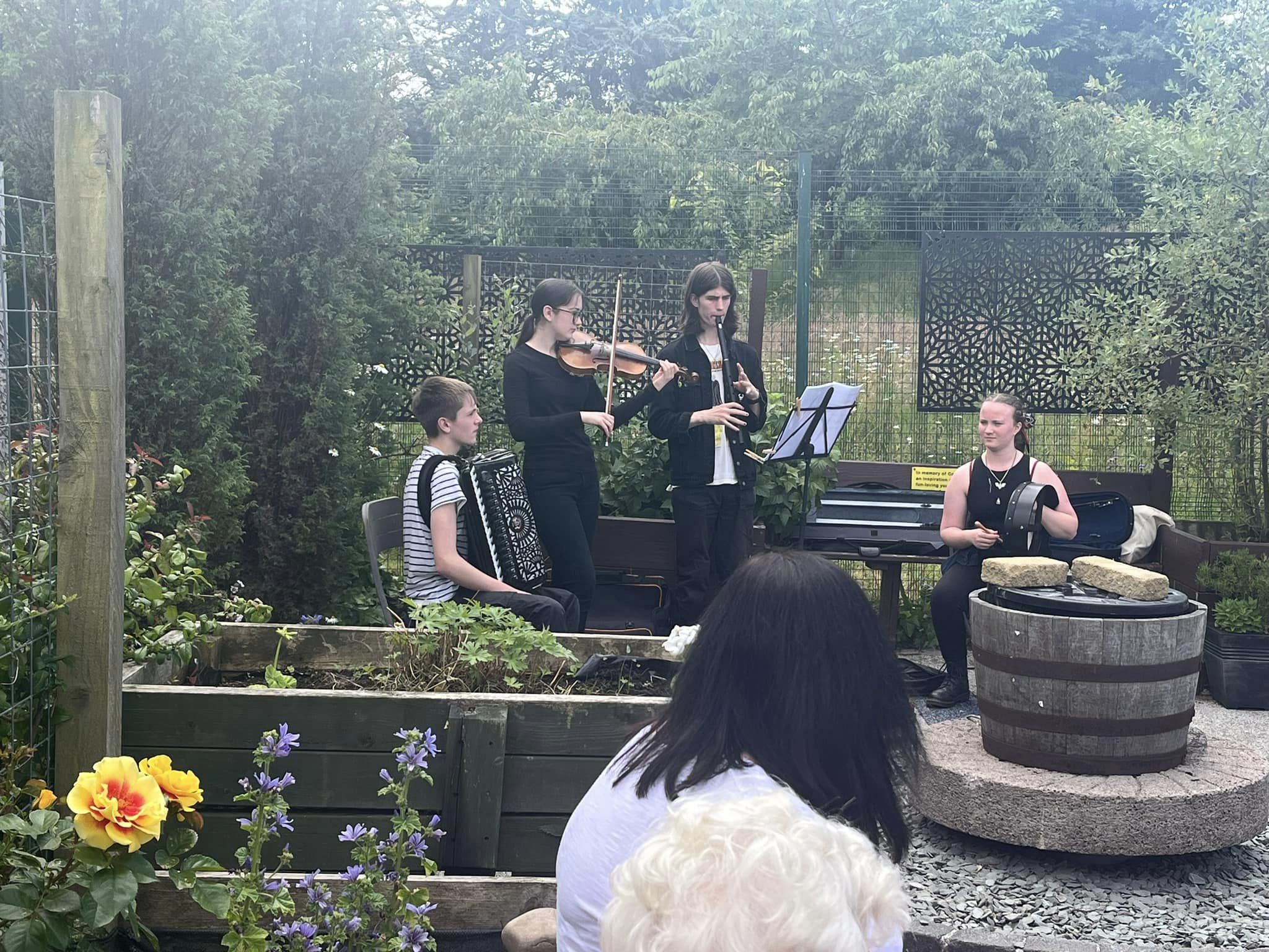 Band performing in a garden.