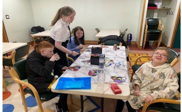 A group of children enjoying an afternoon of craft work with NESS.