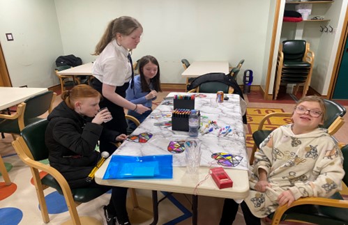 A group of children enjoying an afternoon of craft work with NESS.