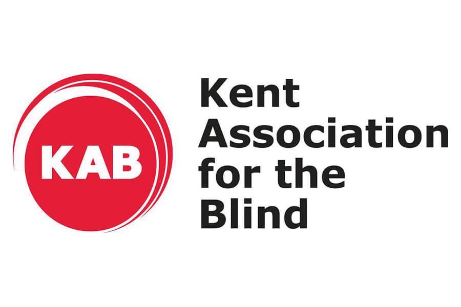 Red circle with the letters KAB inside. To the right of the circle it says "Kent Association for the Blind".