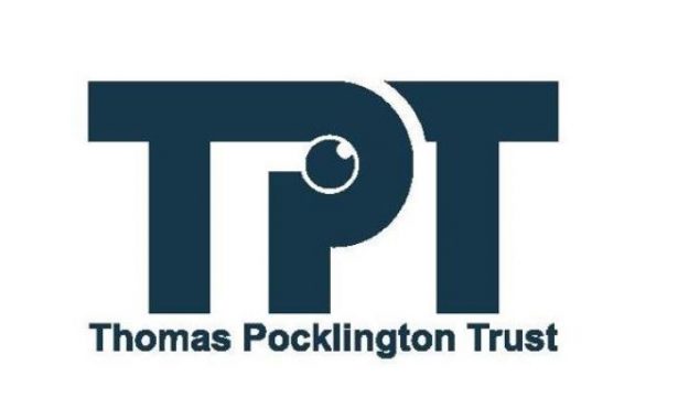 Thomas Pocklington Trust logo. Large TPT letters with the words Thomas Pocklington Trust underneath enclosed in a rectangle. Letters, words and the rectangle border are a dark blue. Within the P of TPT is a small round eye looking upwards.